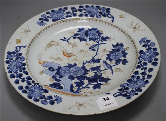 A Chinese grisaille and underglaze blue dish, c.1740, decorated with birds, bamboo, rocks and flowers, label verso from Viscount Bridpo